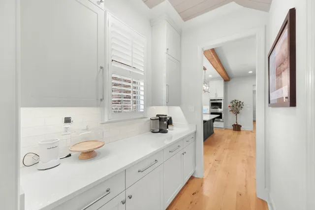 a kitchen with sink and cabinets