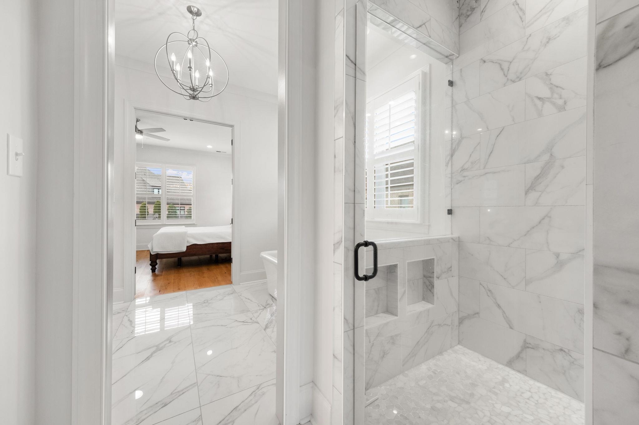 3361 Bailey Station Road Collierville, TN 38017 - Photo 21 of 40 a view of a room that has a bed and a chandelier fan