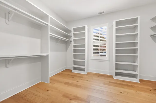 a view of an empty room with empty shelves