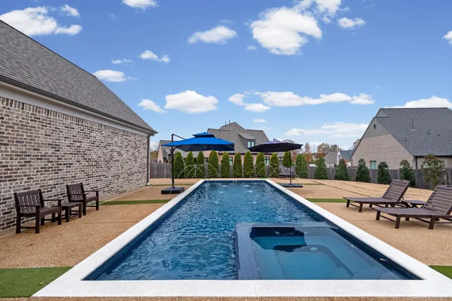 a view of a patio with swimming pool