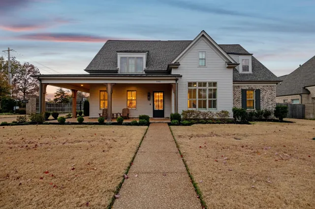 a front view of a house with a yard
