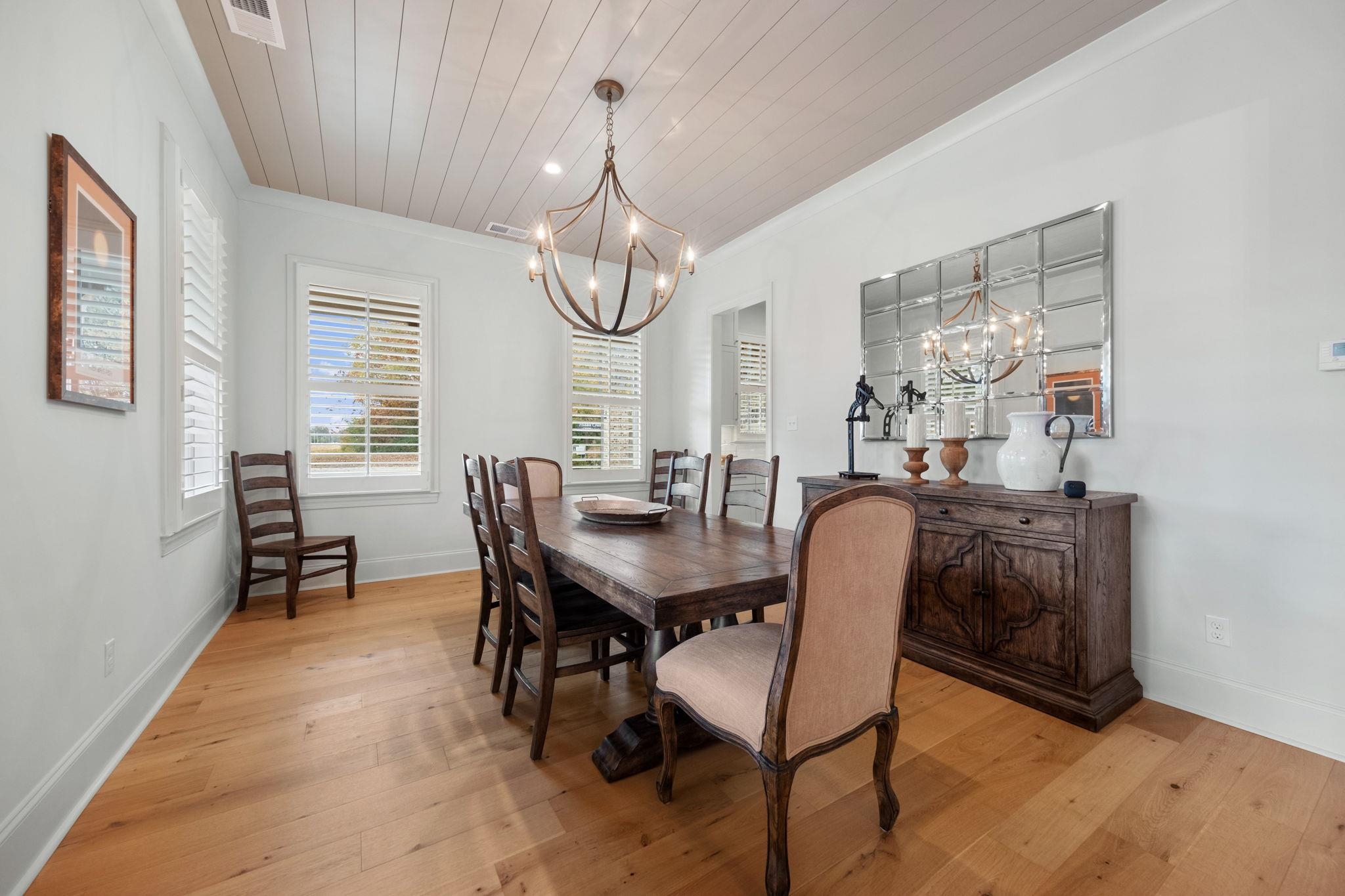 3361 Bailey Station Road Collierville, TN 38017 - Photo 6 of 40 a dining room with furniture a chandelier and window