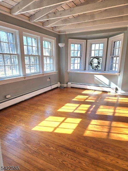 1 Pioneer Trail Oak Ridge, NJ 07438 - Photo 16 of 23 a view of an empty room with window and a kitchen