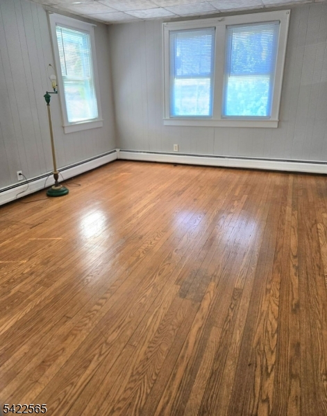 1 Pioneer Trail Oak Ridge, NJ 07438 - Photo 19 of 23 a view of an empty room with wooden floor and a window