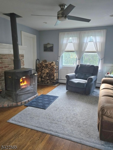 1 Pioneer Trail Oak Ridge, NJ 07438 - Photo 5 of 23 a living room with furniture and a fireplace