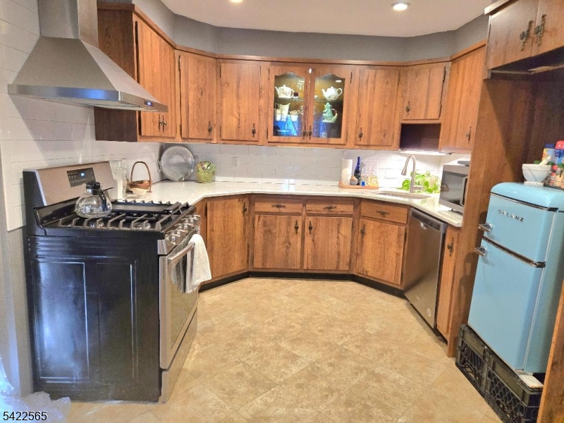 1 Pioneer Trail Oak Ridge, NJ 07438 - Photo 9 of 23 a kitchen with a sink stove and cabinets