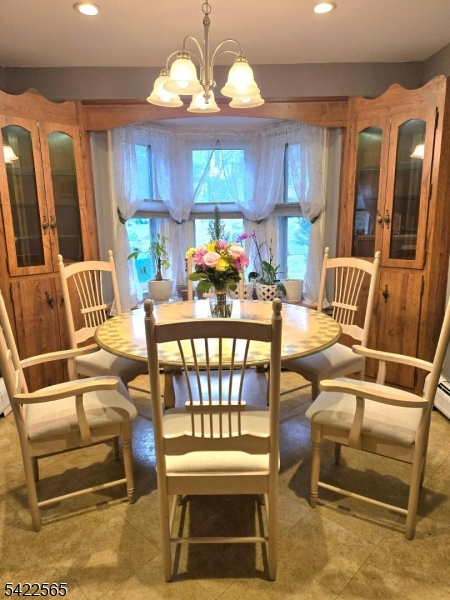 1 Pioneer Trail Oak Ridge, NJ 07438 - Photo 10 of 23 a outdoor space with lots of furniture and chandelier