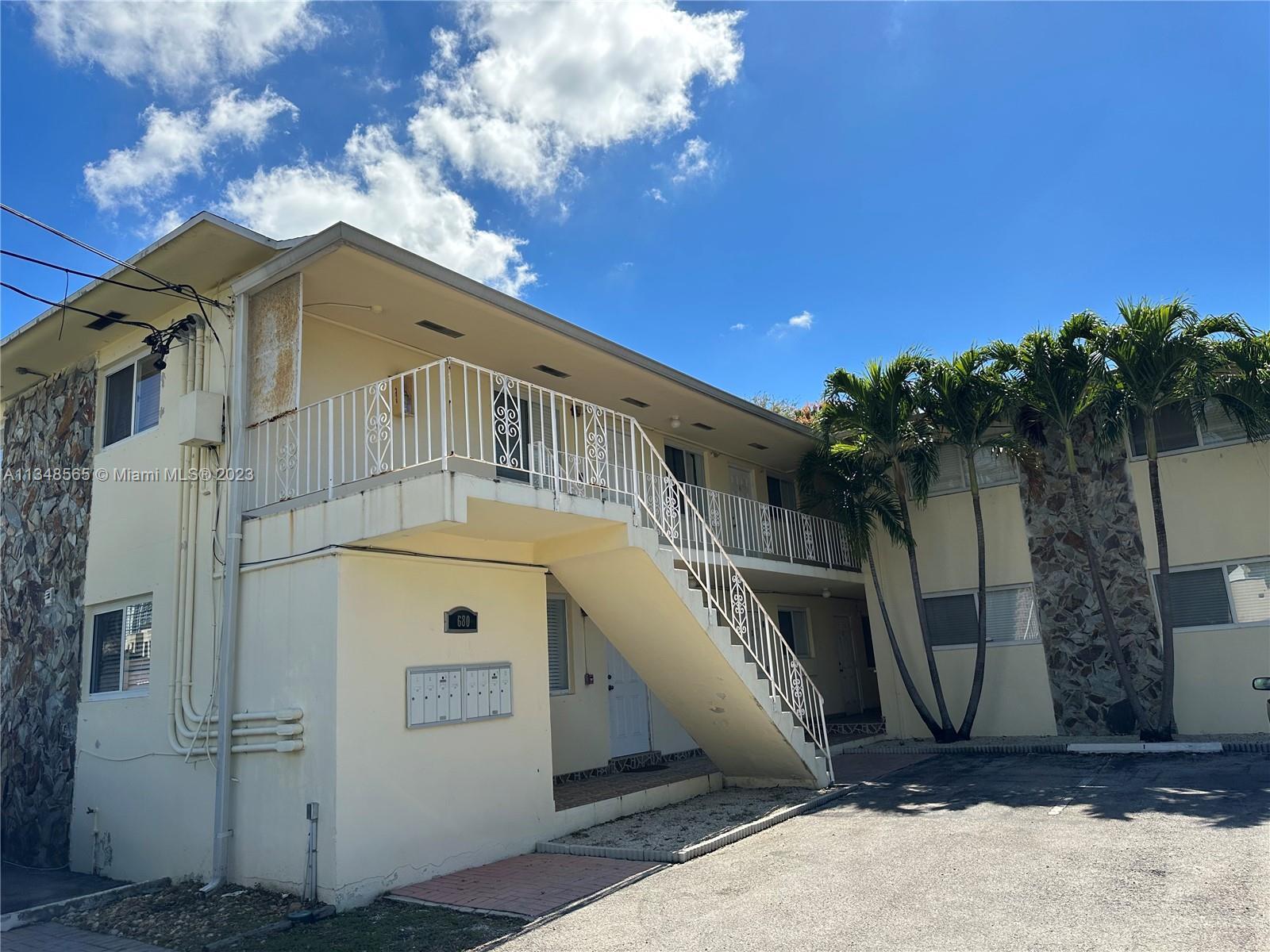 680 Southwest 10th Street, Unit 7 Miami, FL 33130 - Photo 1 of 34 a front view of a house with a yard