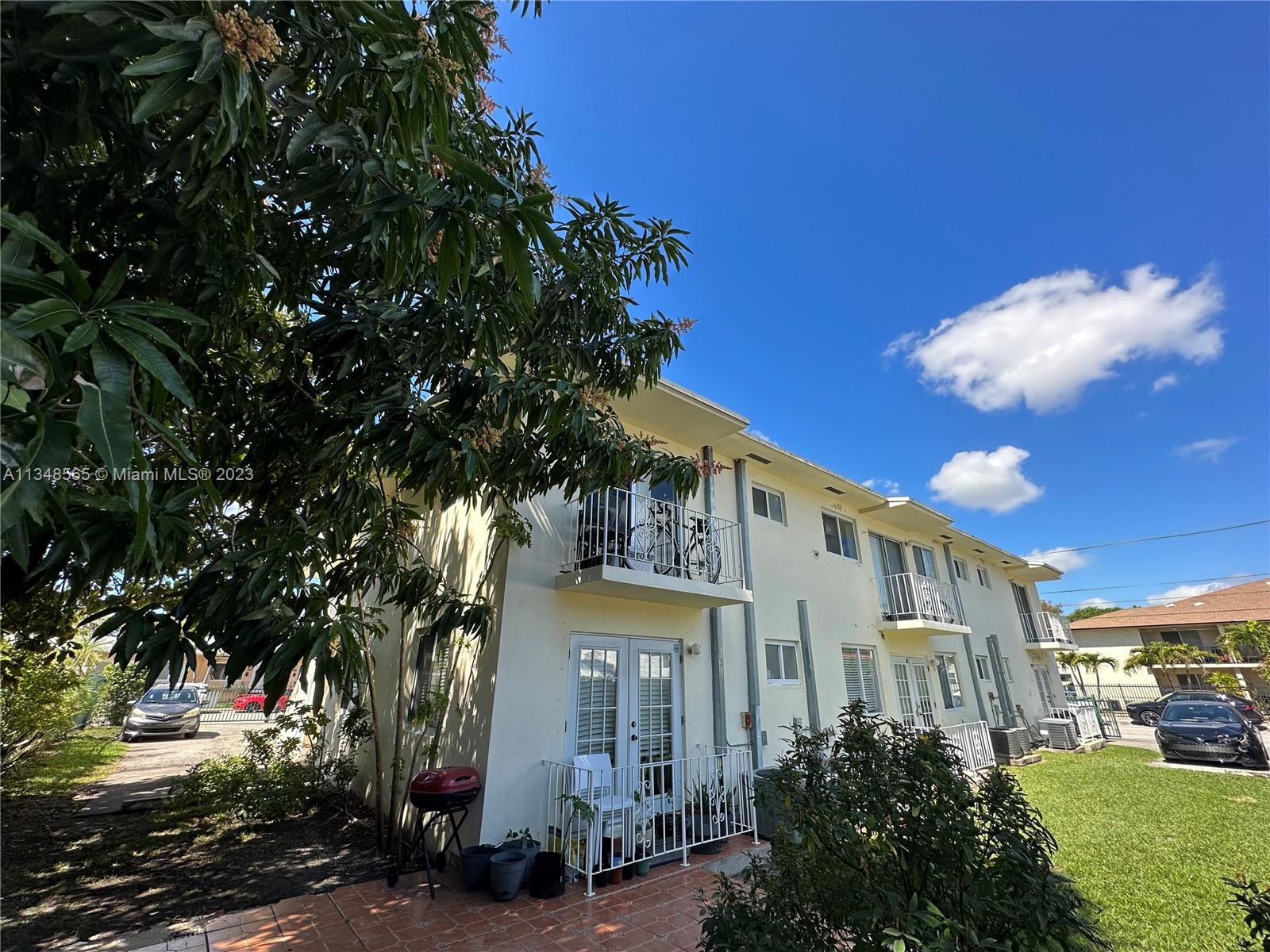 680 Southwest 10th Street, Unit 7 Miami, FL 33130 - Photo 2 of 34 a front view of a residential houses with yard and green space