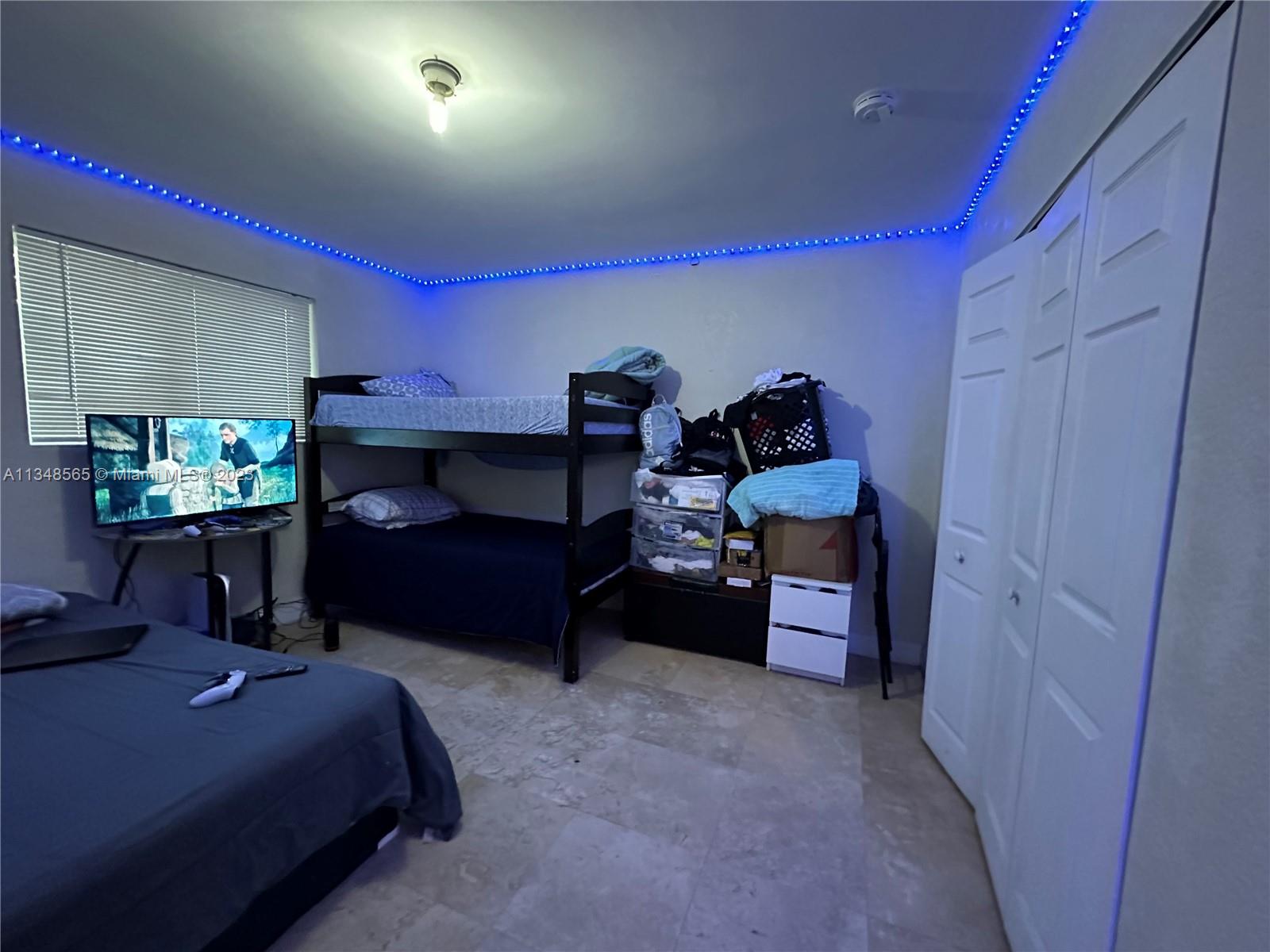 680 Southwest 10th Street, Unit 7 Miami, FL 33130 - Photo 26 of 34 a bed room with furniture and a fireplace