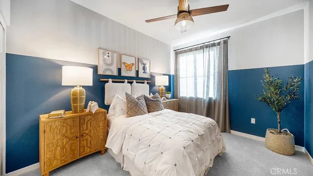 a bedroom with bed and window