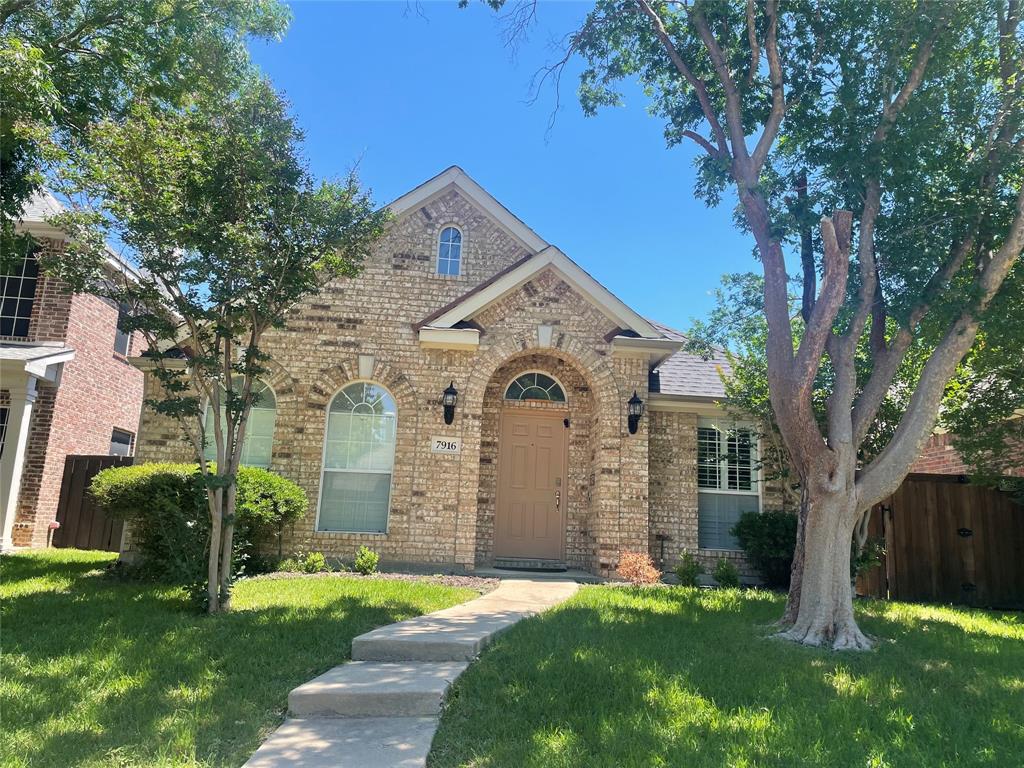 7916 Country Ridge Lane Plano, TX 75024 - Photo 1 of 27 a front view of a house with garden