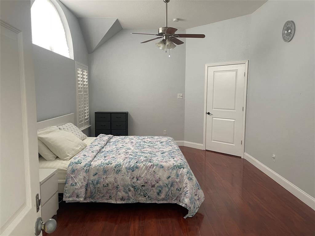 7916 Country Ridge Lane Plano, TX 75024 - Photo 2 of 27 a bedroom with a bed and a window