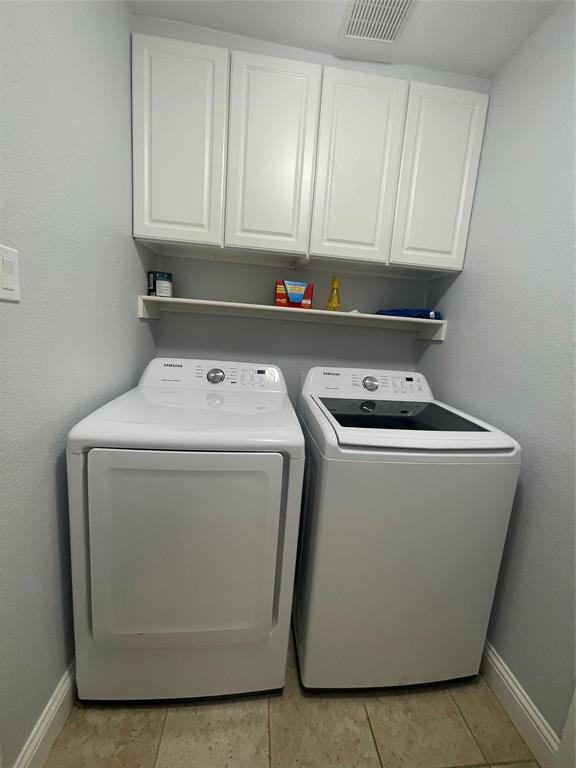 7916 Country Ridge Lane Plano, TX 75024 - Photo 23 of 27 a utility room with dryer and washer