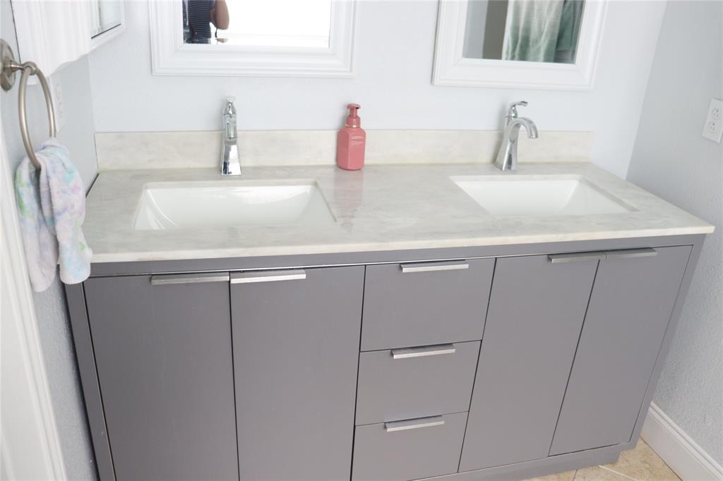 7916 Country Ridge Lane Plano, TX 75024 - Photo 10 of 27 a close view of sink and tap