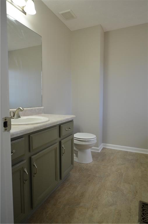140 Stewart Drive Dallas, GA 30132 - Photo 12 of 21 a bathroom with a sink a toilet and a mirror