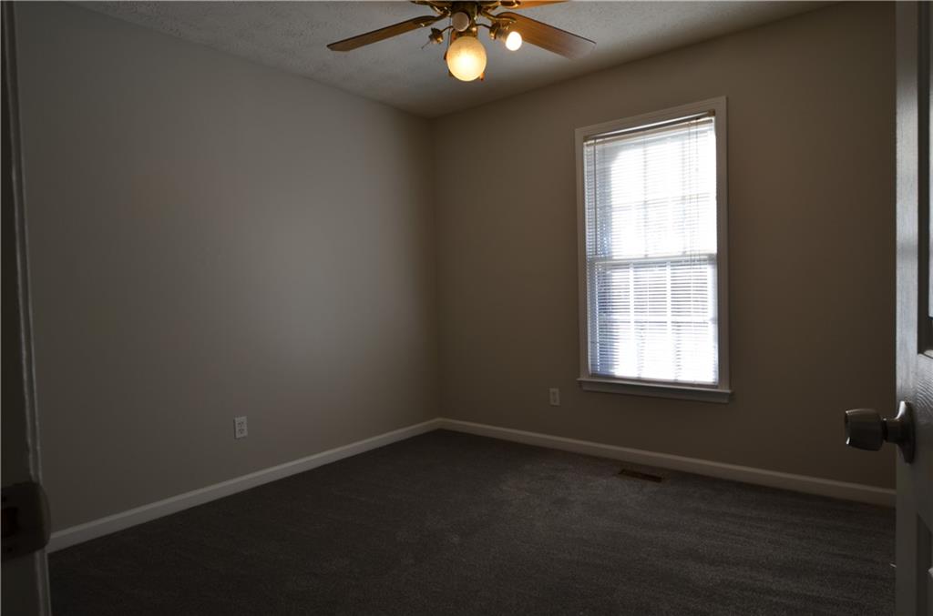140 Stewart Drive Dallas, GA 30132 - Photo 13 of 21 an empty room with a window
