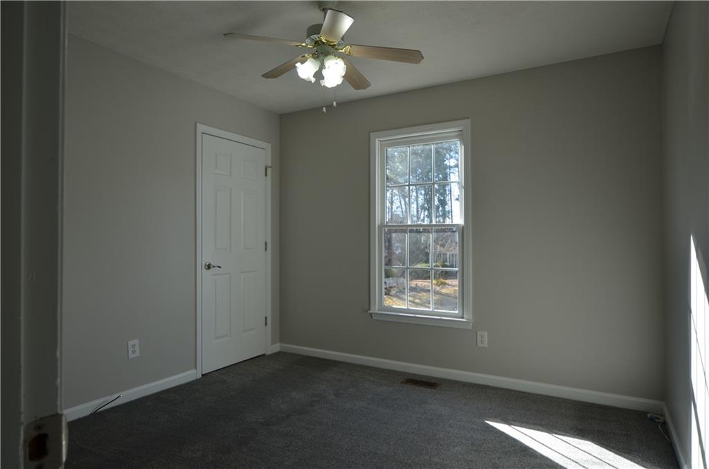 140 Stewart Drive Dallas, GA 30132 - Photo 9 of 21 a view of an empty room with a window