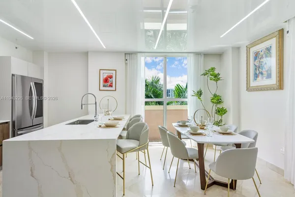 a bedroom with a bed and large window