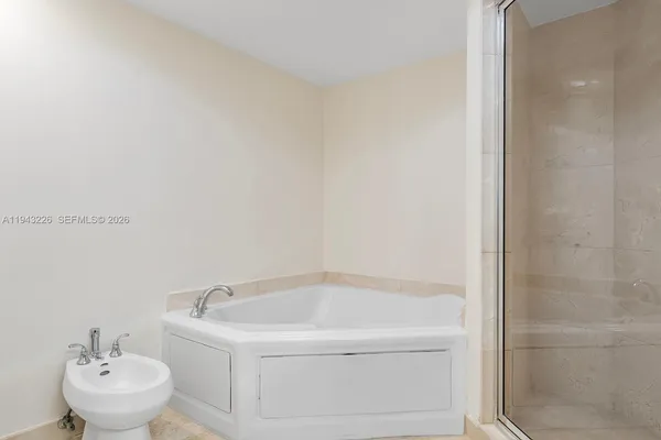 a room with a bed and a window