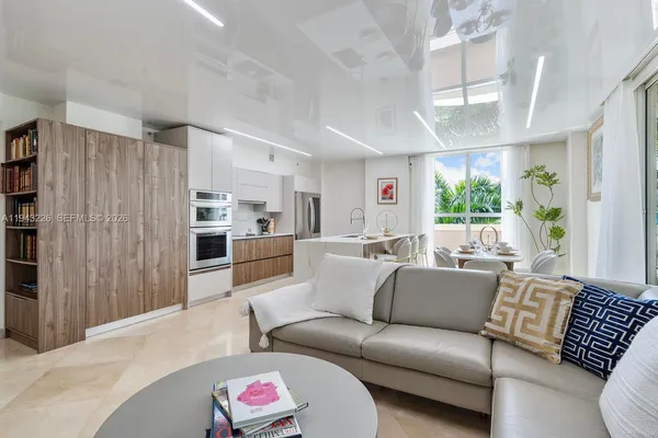 a kitchen with sink refrigerator and window