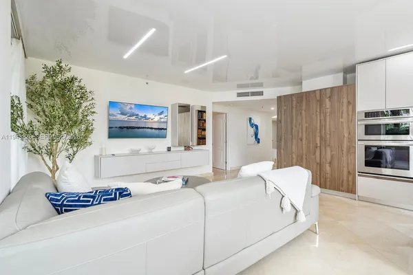 a kitchen with stainless steel appliances granite countertop a refrigerator sink and cabinets