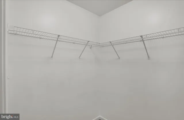 a view of a room with racks on the wall