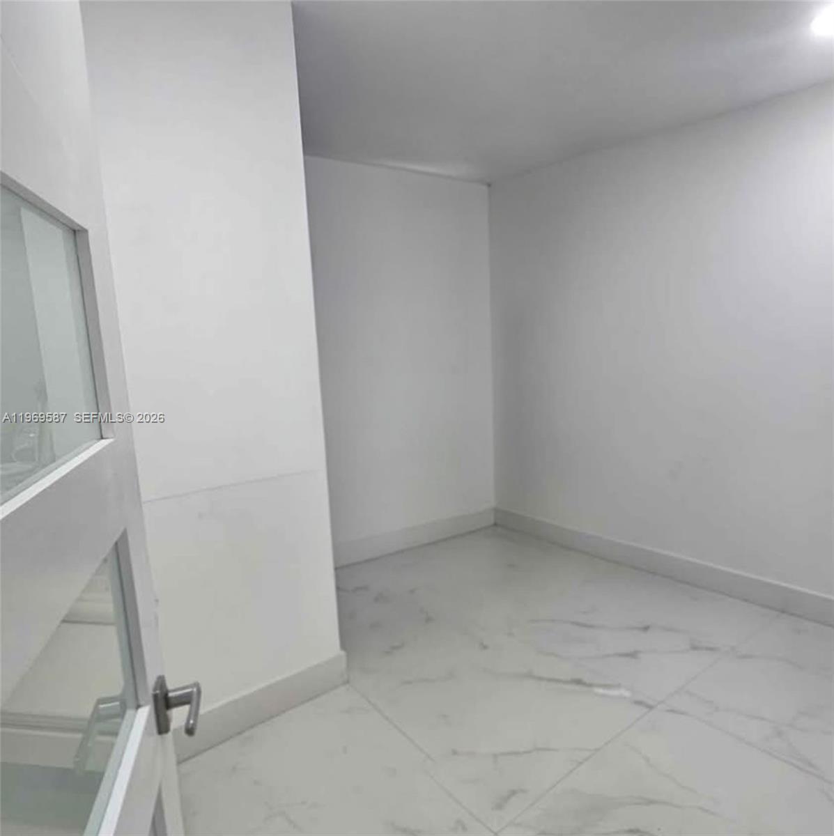 11417 Southwest 35th Lane Miami, FL 33165 - Photo 11 of 18 wooden floor in an empty room