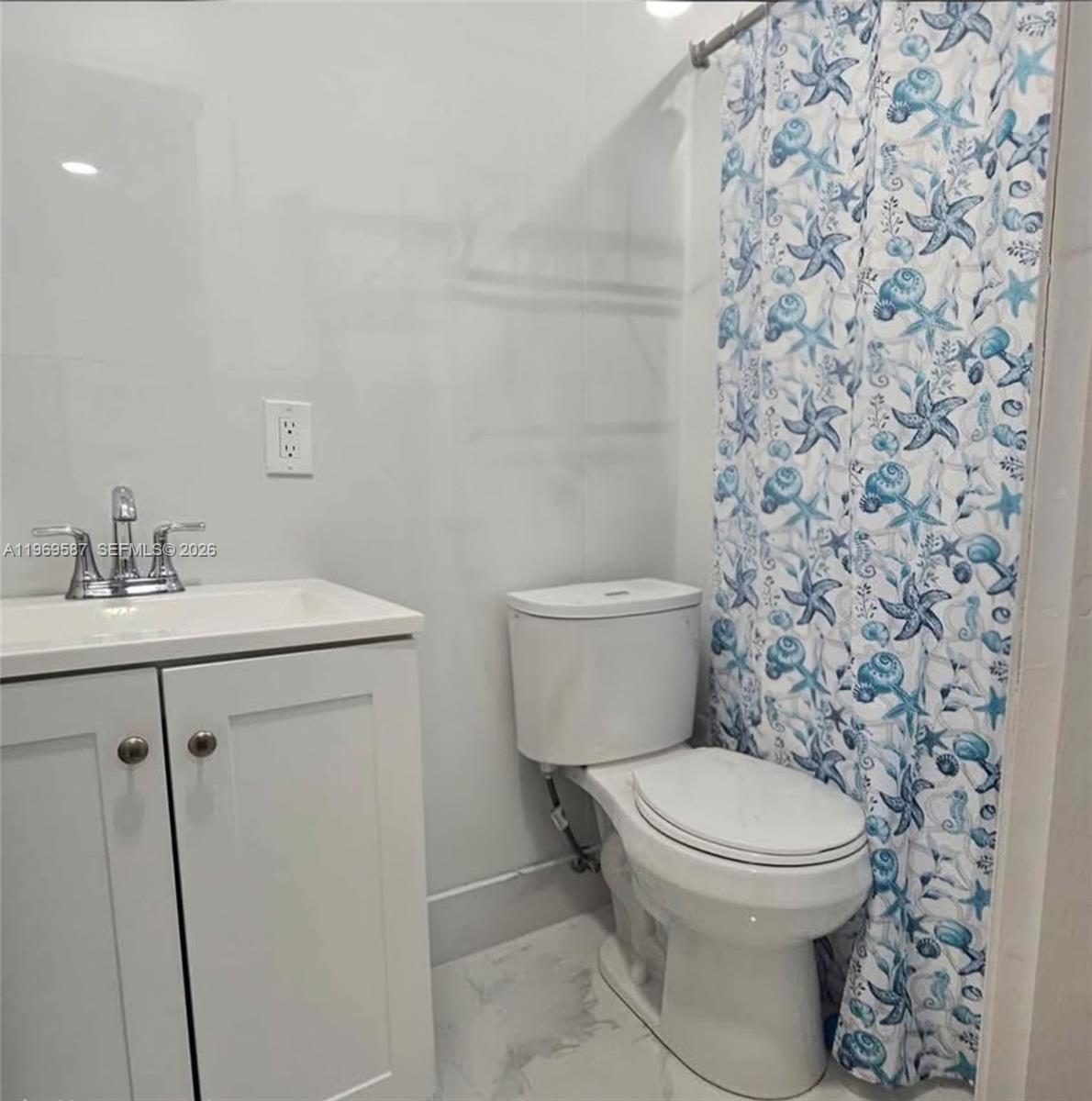 11417 Southwest 35th Lane Miami, FL 33165 - Photo 13 of 18 a bathroom with a toilet and a sink