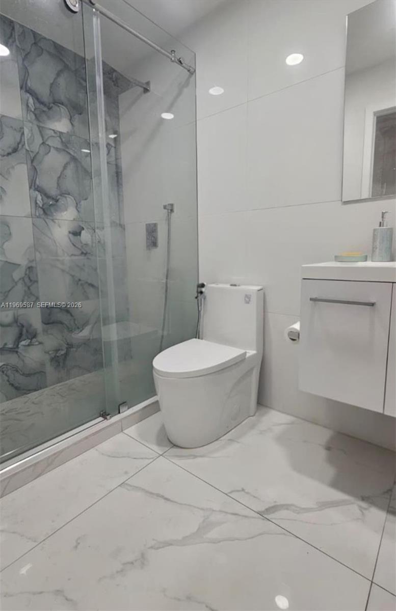 11417 Southwest 35th Lane Miami, FL 33165 - Photo 15 of 18 a bathroom with a toilet and a shower