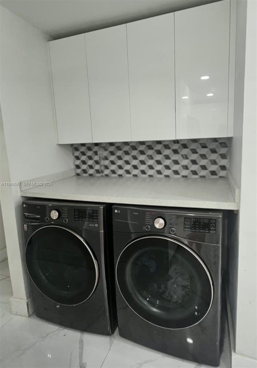 11417 Southwest 35th Lane Miami, FL 33165 - Photo 16 of 18 a utility room with dryer and washer