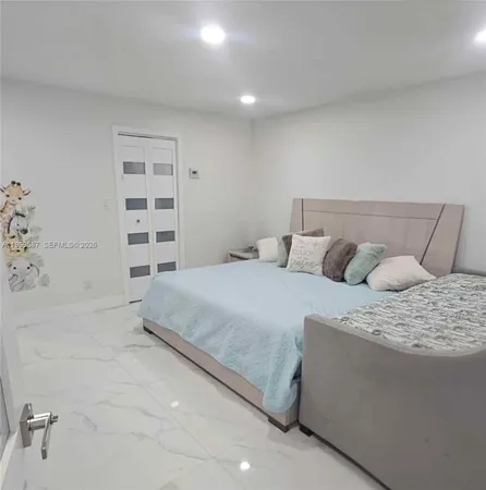 a bed room with a bed and a couch