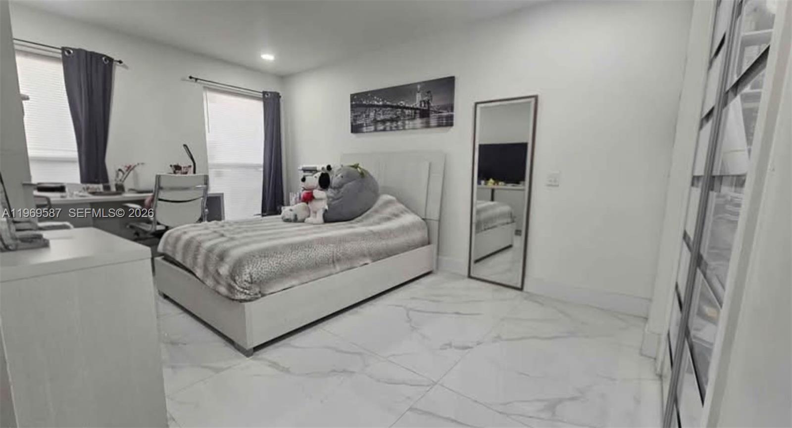 11417 Southwest 35th Lane Miami, FL 33165 - Photo 10 of 18 a bed room with a bed and a couch