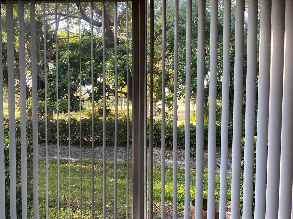 8720 Cypress Walk Court, Unit 8720 Tamarac, FL 33321 - Photo 13 of 36 a view of outdoor space and garden view