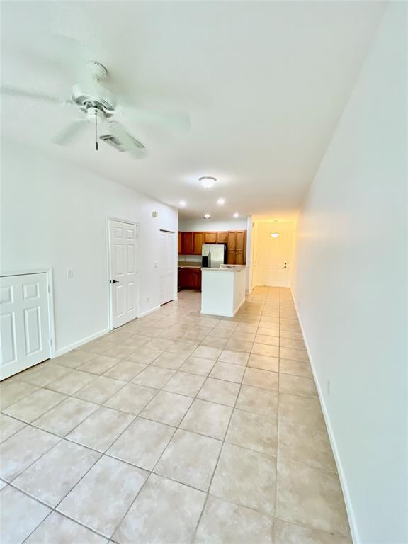 8720 Cypress Walk Court, Unit 8720 Tamarac, FL 33321 - Photo 22 of 36 a view of a hallway with a chandelier