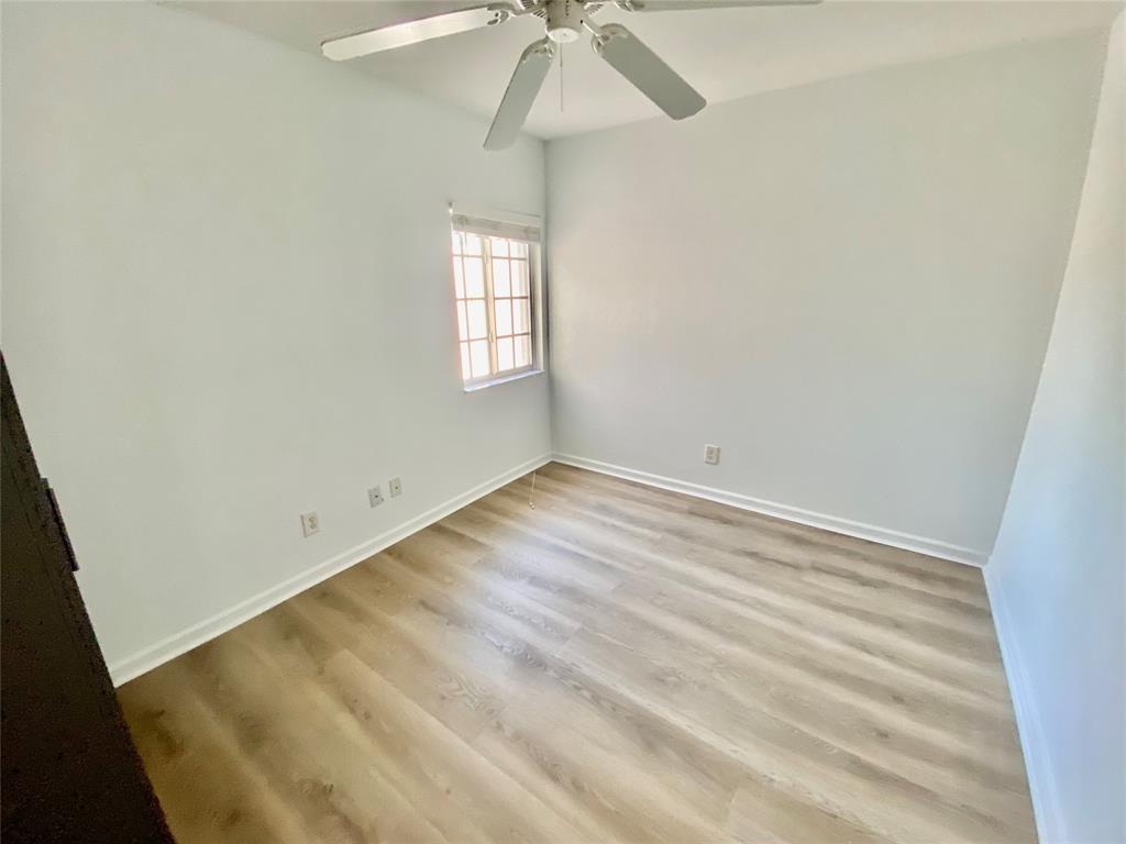 8720 Cypress Walk Court, Unit 8720 Tamarac, FL 33321 - Photo 29 of 36 an empty room with a window