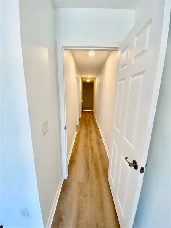 8720 Cypress Walk Court, Unit 8720 Tamarac, FL 33321 - Photo 31 of 36 a view of a hallway with wooden floor and staircase