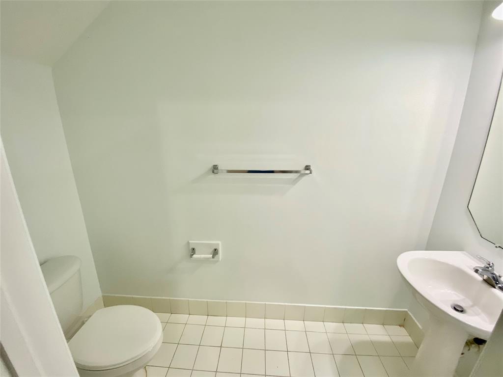 8720 Cypress Walk Court, Unit 8720 Tamarac, FL 33321 - Photo 5 of 36 a bathroom with a sink and a mirror
