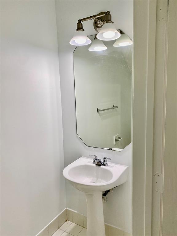 8720 Cypress Walk Court, Unit 8720 Tamarac, FL 33321 - Photo 9 of 36 a bathroom with a sink and a mirror