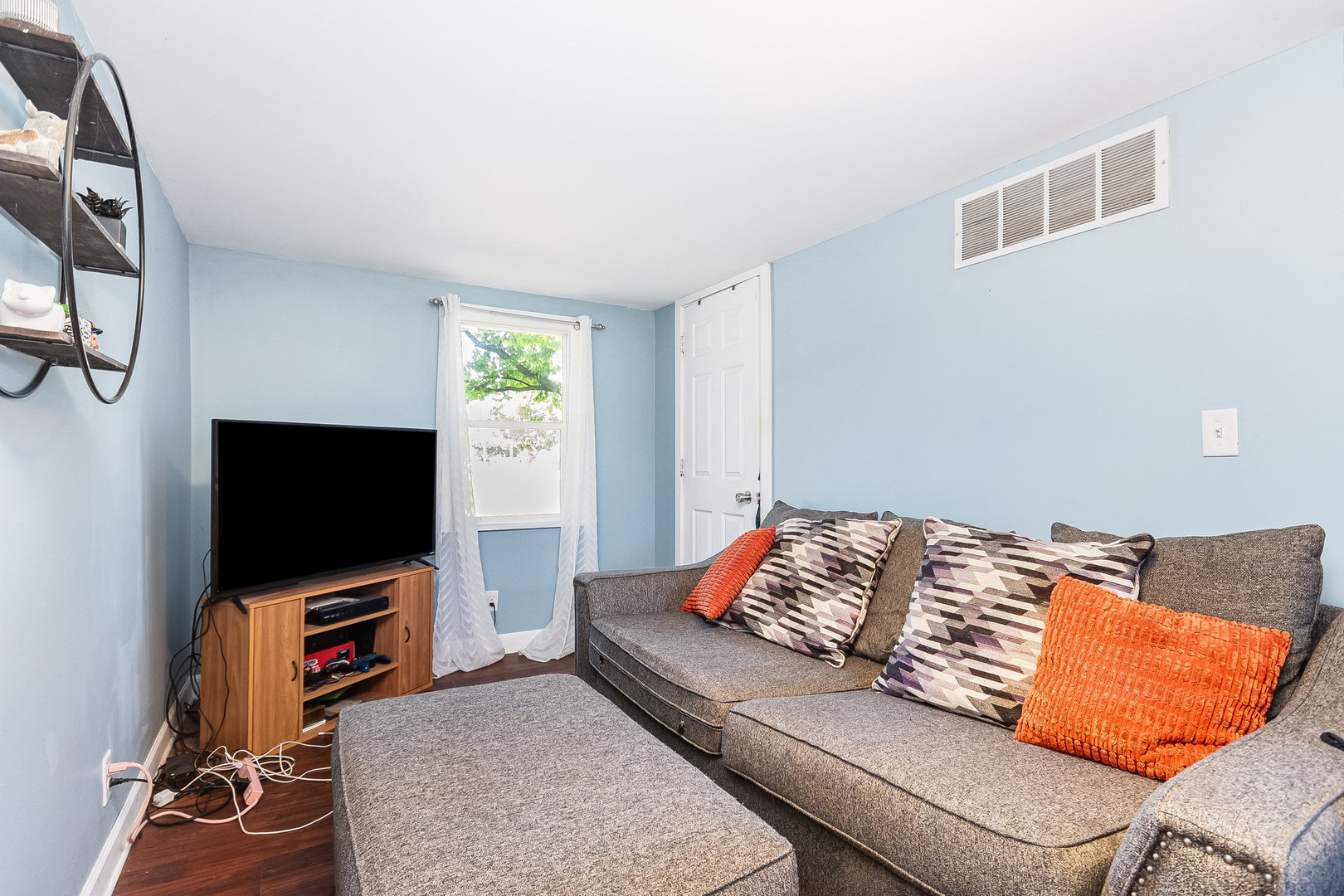 341 West Kennedy Road Braidwood, IL 60408 - Photo 14 of 15 a living room with a flat screen tv and gym equipment