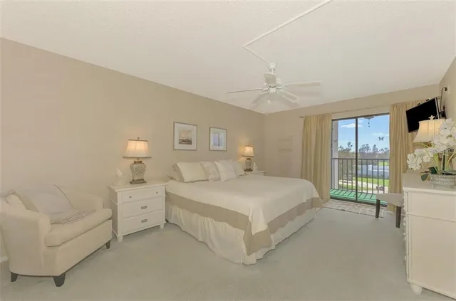 a spacious bedroom with a bed and a large window