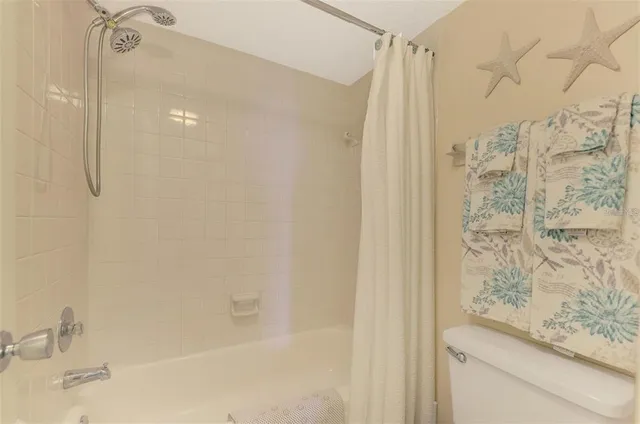 a bathroom with a shower and a sink