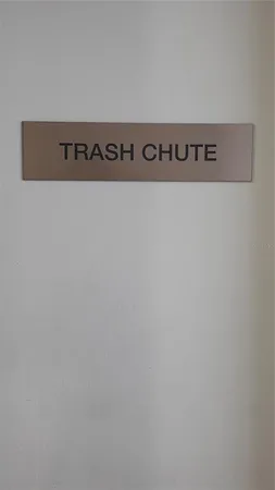 a bathroom with a toilet and a mirror