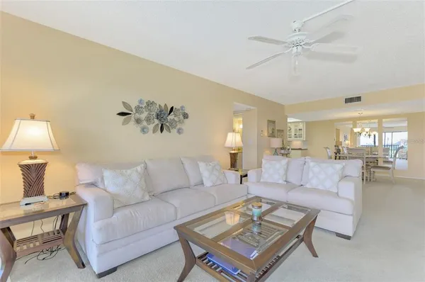 a living room with furniture and a table