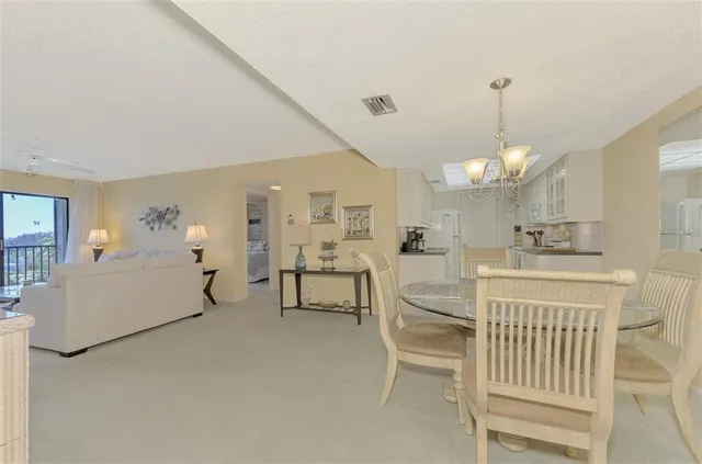 a very nice looking room with a large mirror and furniture