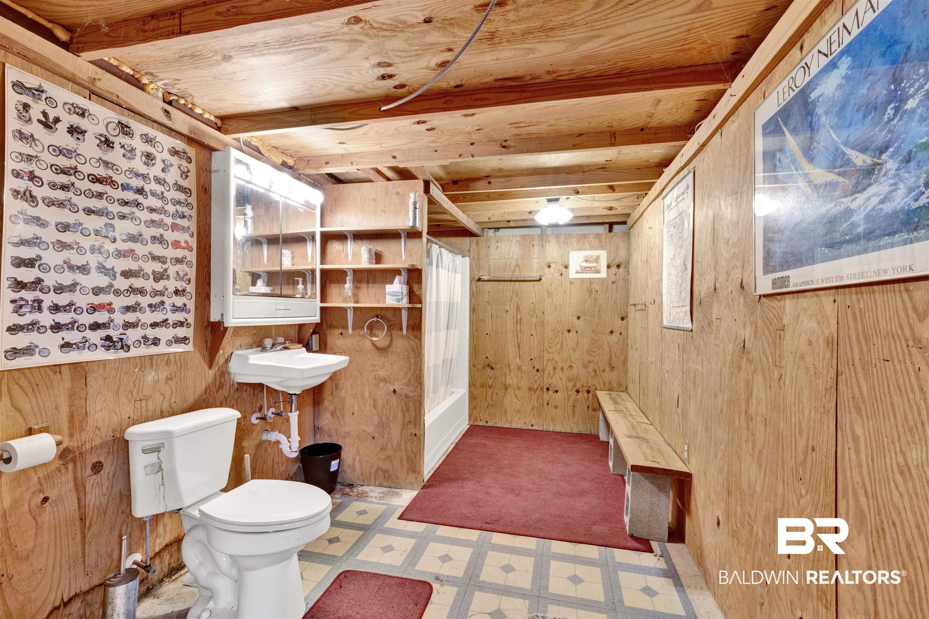 36397 Alexandria Trail Stapleton, AL 36578 - Photo 57 of 65 Full bath featuring light flooring, wood walls, shower / bath combo with shower curtain, and wood ceiling