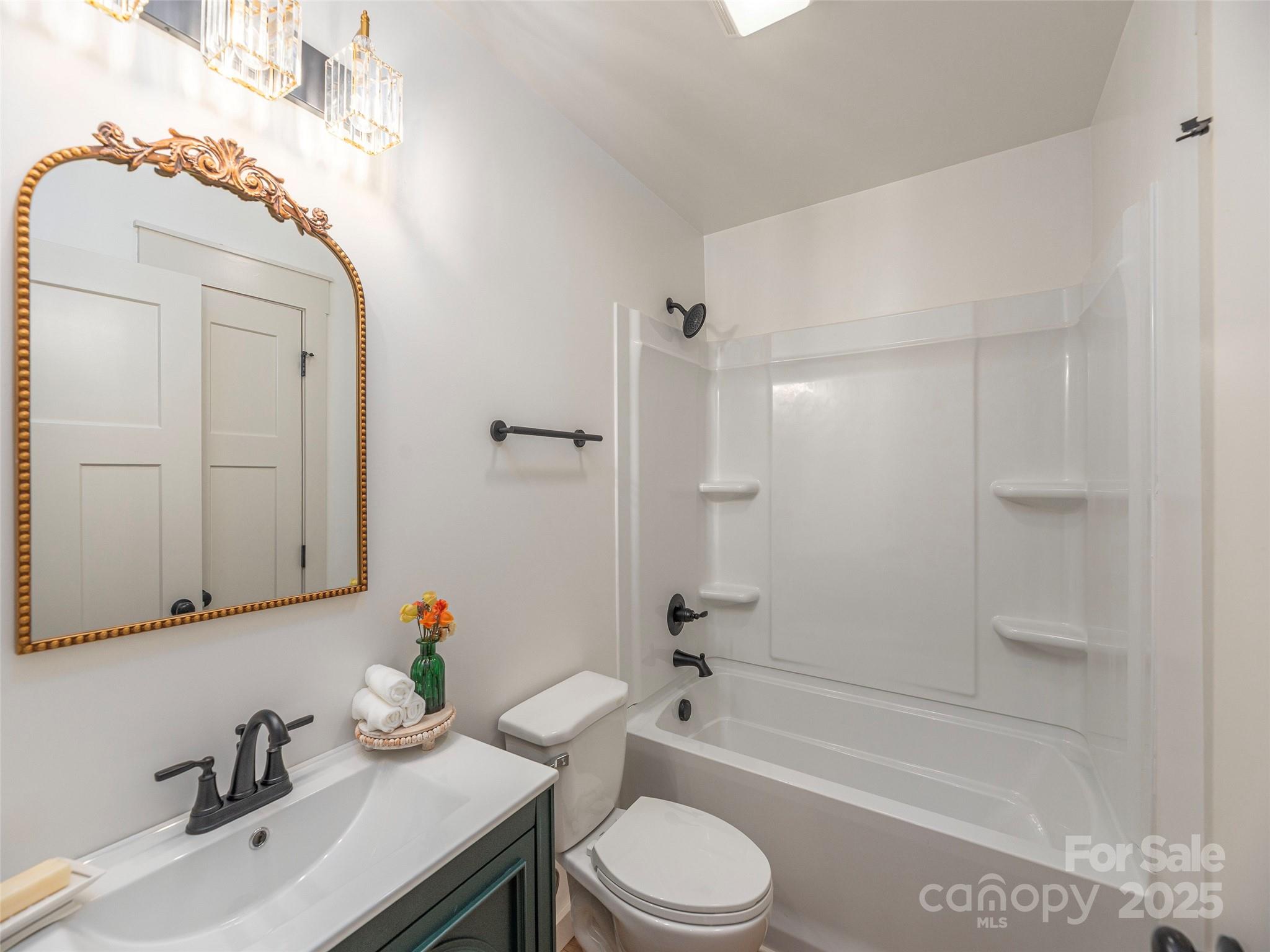 93 Cresthaven Drive Clyde, NC 28721 - Photo 19 of 27 a bathroom with a sink toilet tub and shower