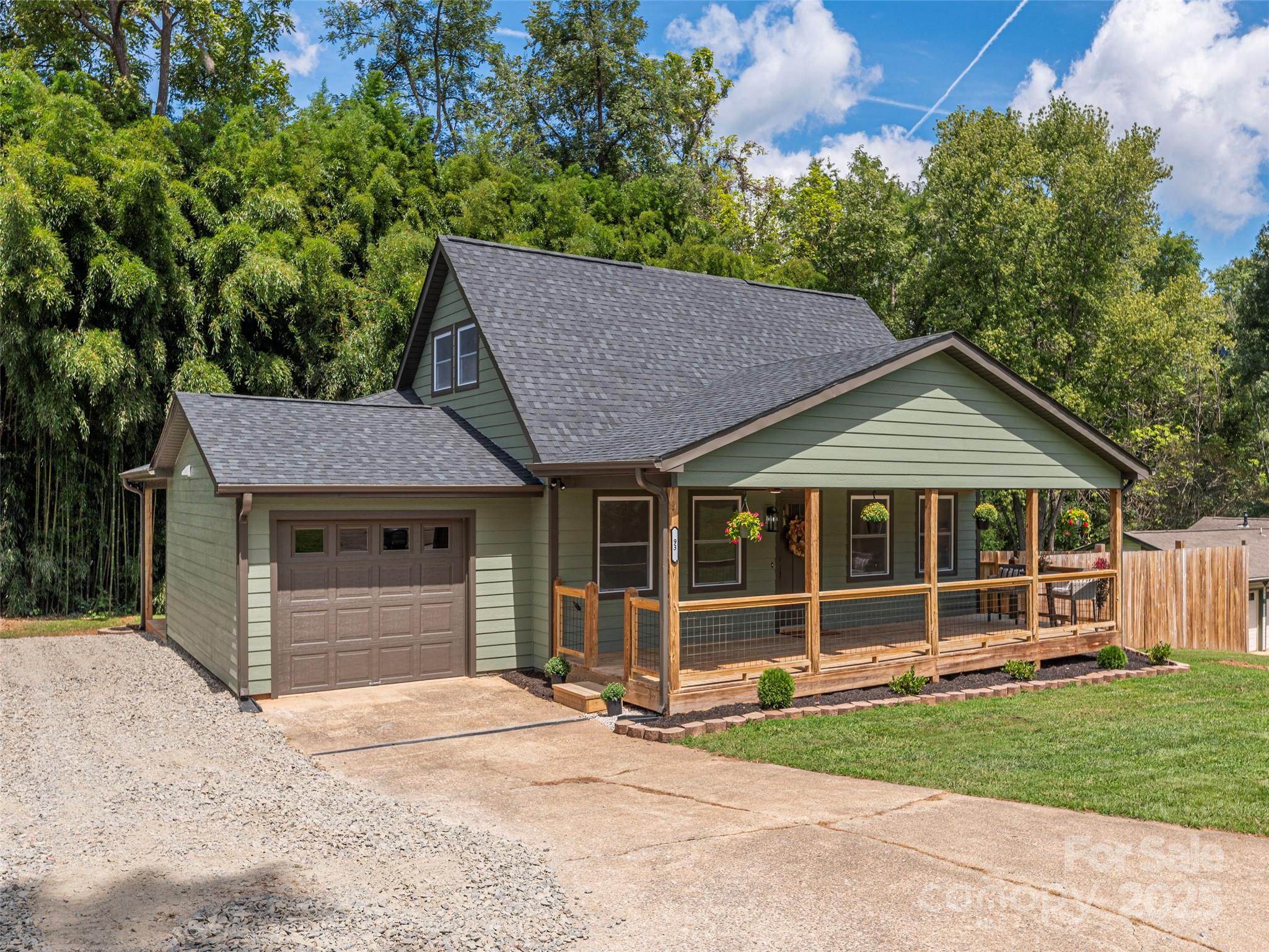 93 Cresthaven Drive Clyde, NC 28721 - Photo 2 of 27 a view of a house with a garden and pathway