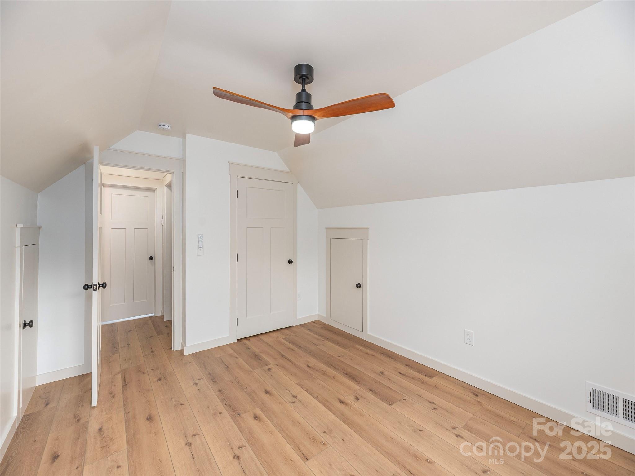 93 Cresthaven Drive Clyde, NC 28721 - Photo 21 of 27 a view of empty room with wooden floor