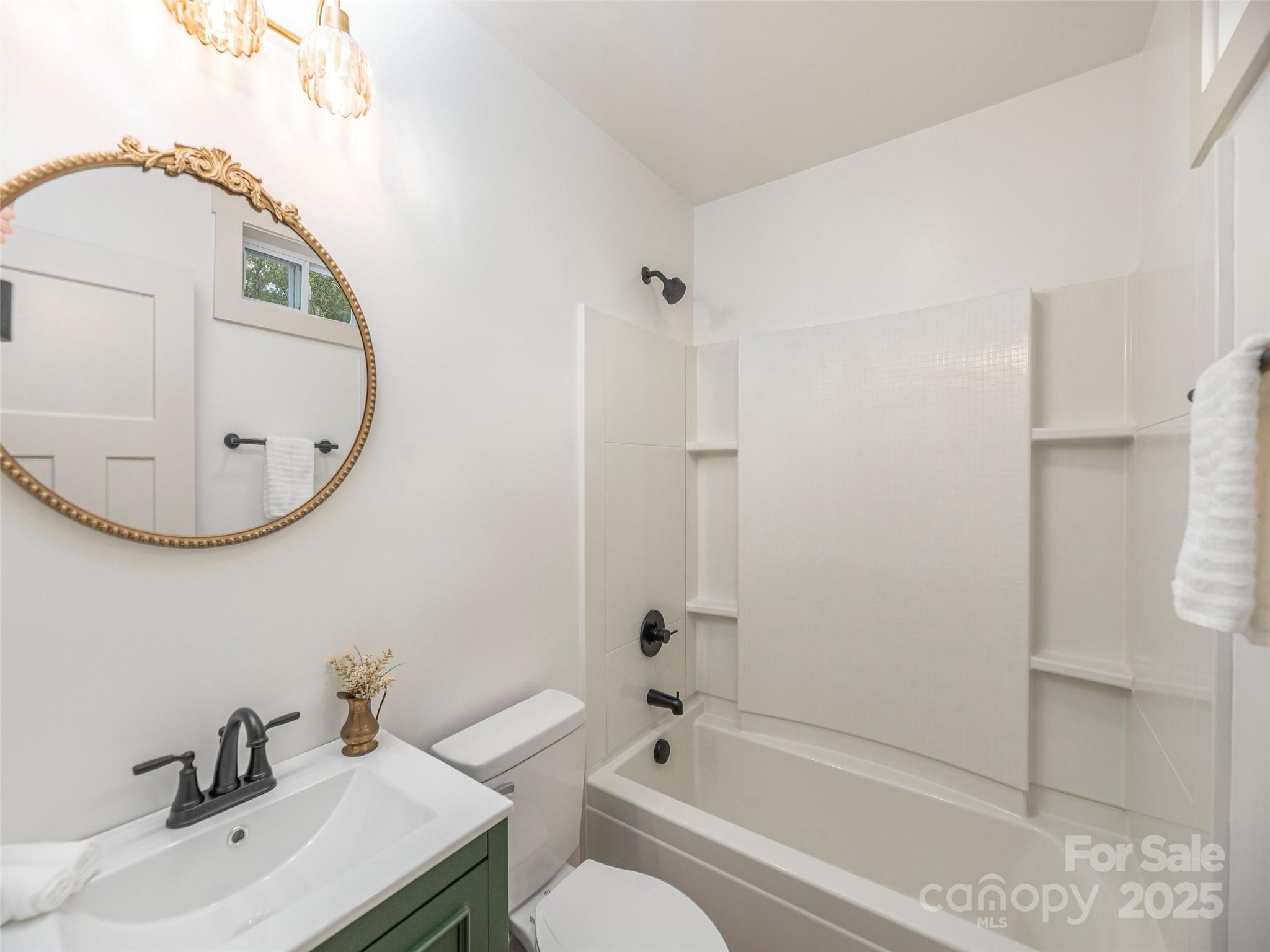 93 Cresthaven Drive Clyde, NC 28721 - Photo 22 of 27 a bathroom with a sink and a mirror